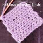 Purple crochet swatch made with half double crochet stitches, with a hook attached.