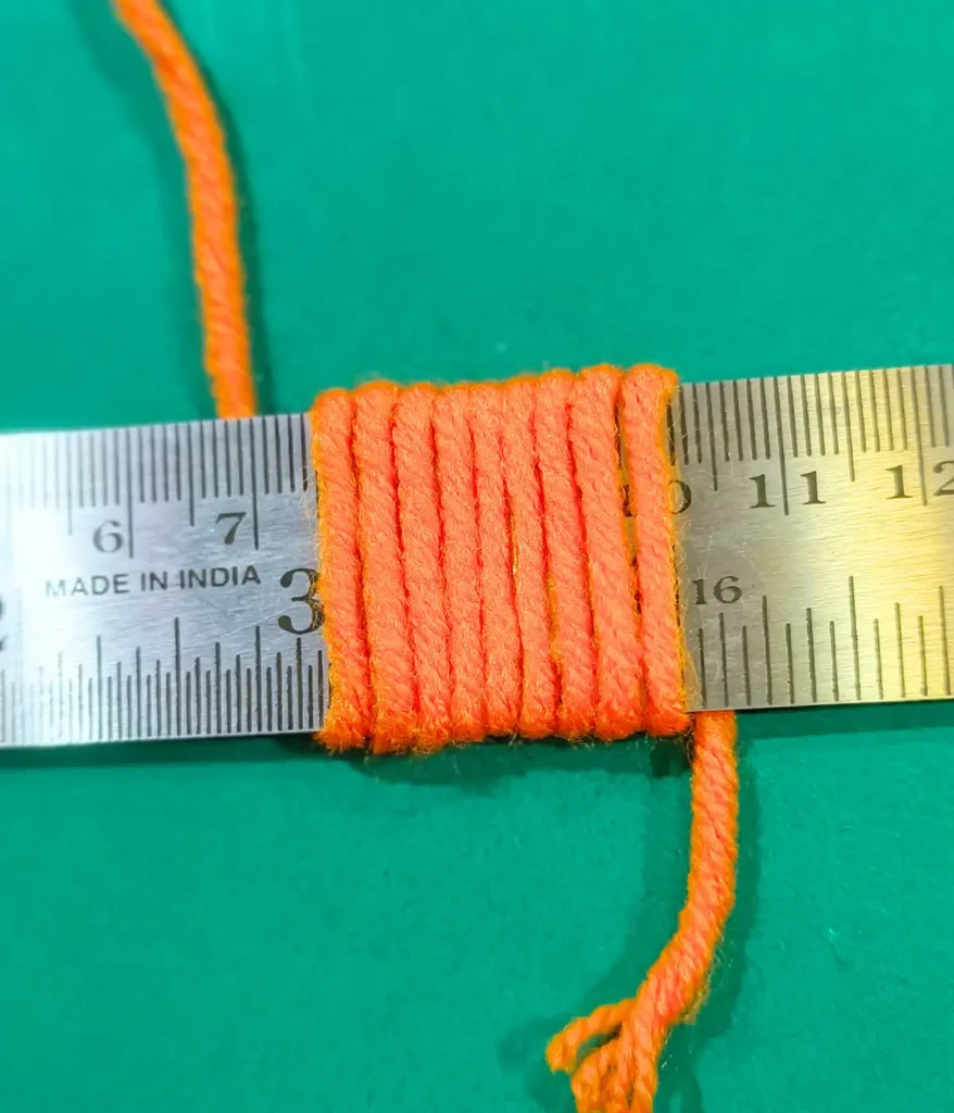 Yarn is wrapped on a ruler